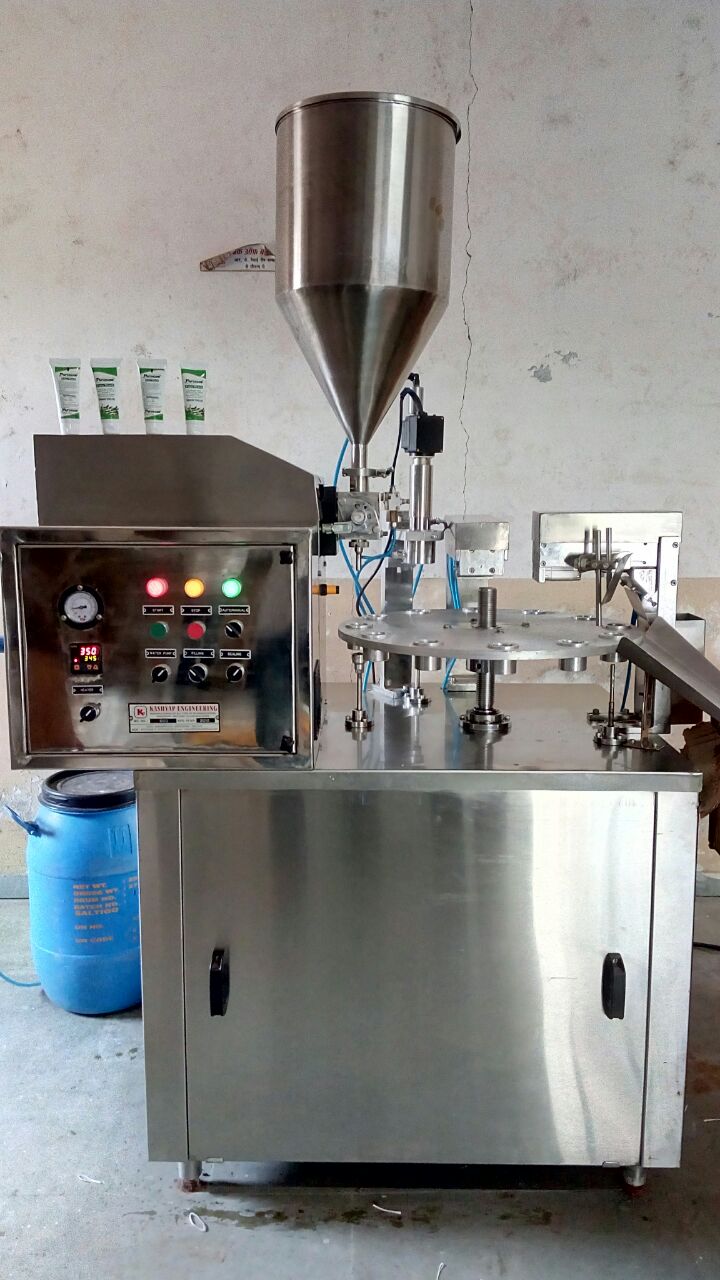 Syrup filling and capping machine